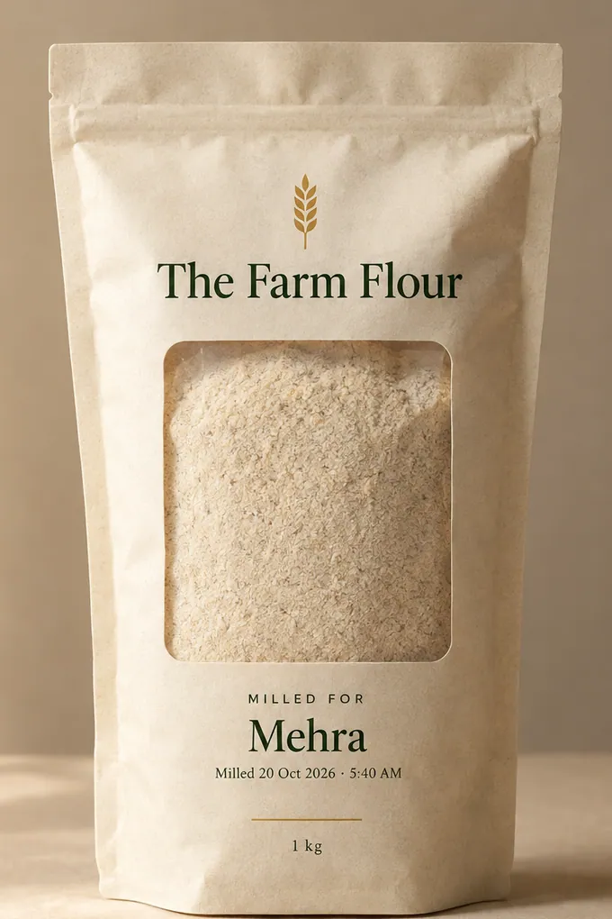 A Farm Flour pack: off-white pouch with a clear window showing the flour, printed with the brand, Milled for Mehra, and the mill date and time